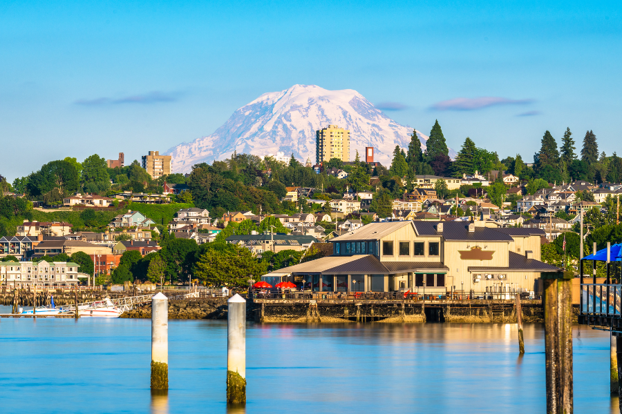 Tacoma, WA near the water with evergreen trees and mountain in the background