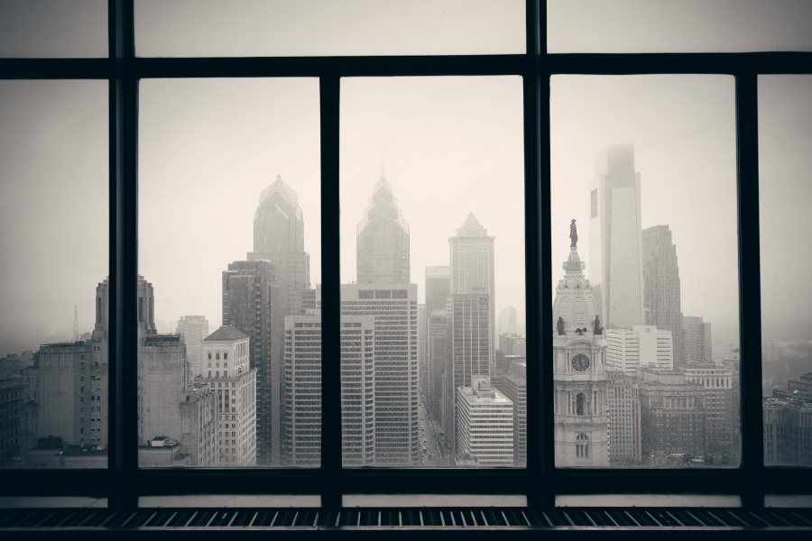 Black and white image of downtown Philly from a window view