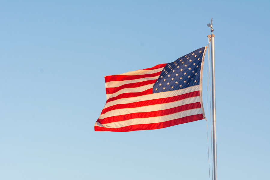 American flag blowing in the wind on a clear day