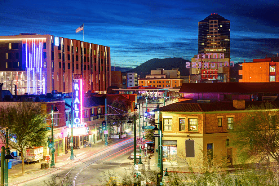 Downtown Tucson AZ nightlife with lit up buildings at dusk 