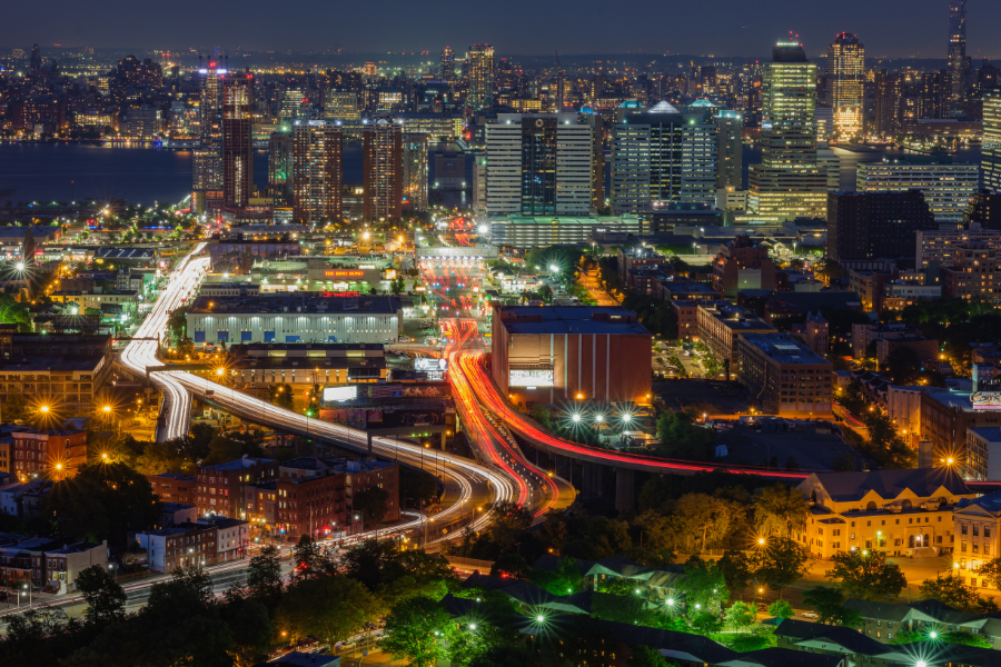 Jersey City, NJ at night with bright lights 