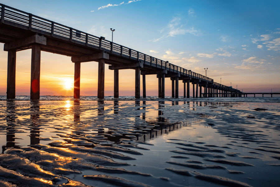 fishing pier during the sunset 