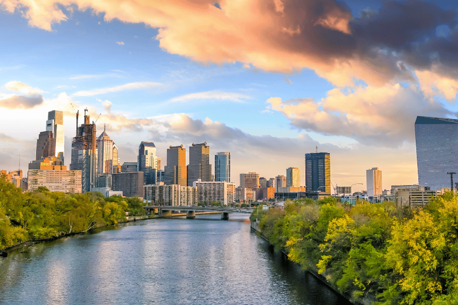 Image of river with green landscaping with city skyline