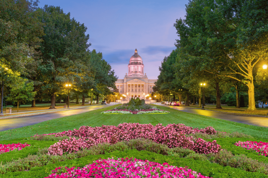 Capital building in Kentucky with pink flowers