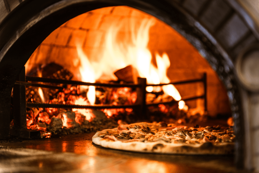 Brick oven with pizza cooking 