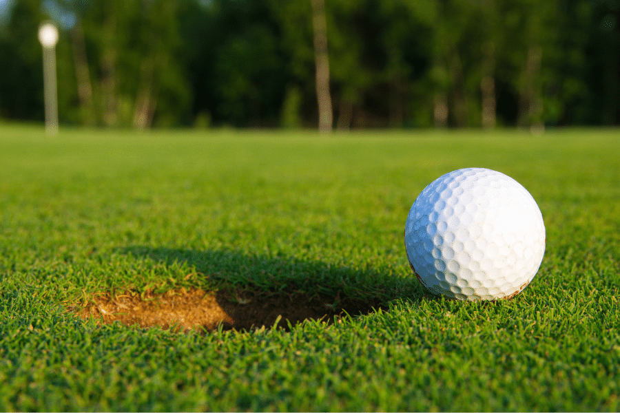 Golf in Tucson Arizona with a close up of a golf ball and beautiful course