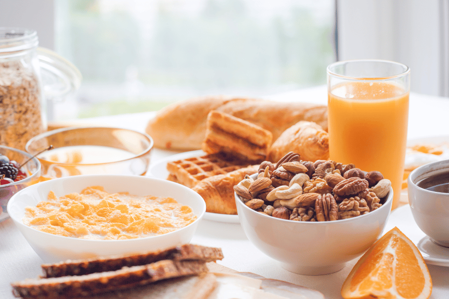 breakfast foods cereal, waffles, and orange juice