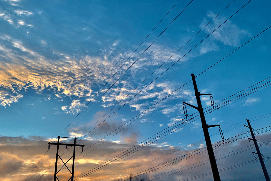 Utility poles during sunset blue sky 