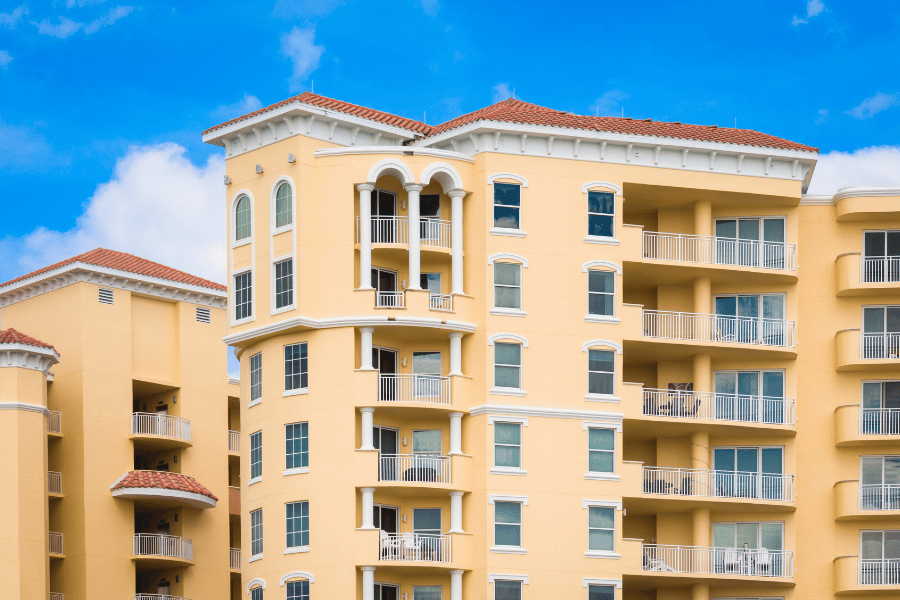 yellow condo towers in Daytona Beach, FL with balconies