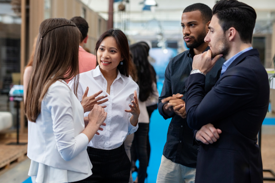 Group of people in a public setting networking