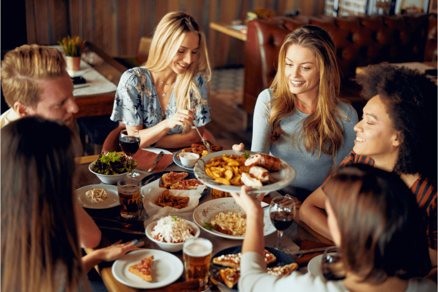 Guests dining at restaurant enjoying a meal together