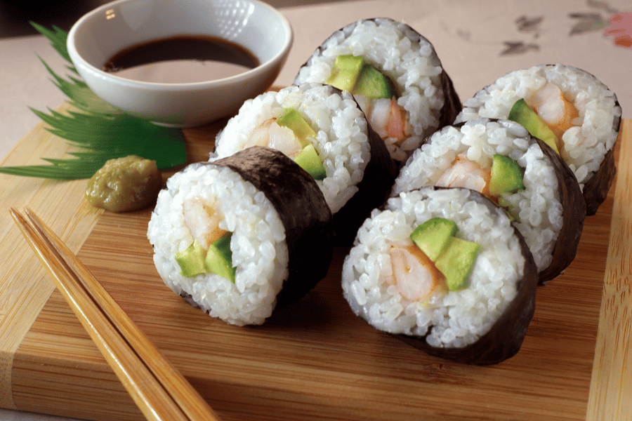 sushi chopsticks crab avocado cucumber rice