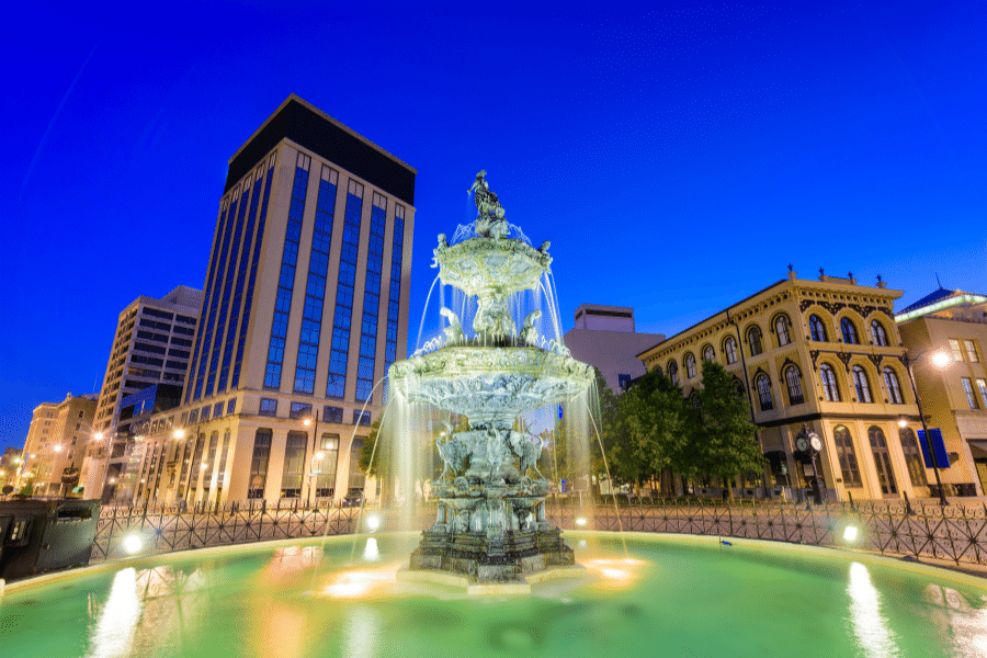 Montgomery, AL at night with a fountain and buildings