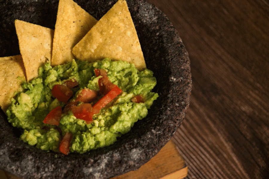 freshly made guacamole with chips 