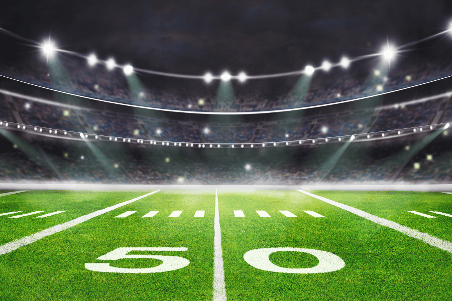 football field with bright lights at night 