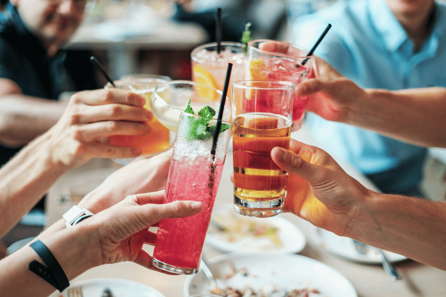 friends drinking cocktails together 