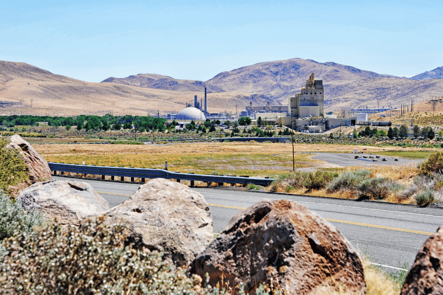 Sparks, NV industrial region with mountains in the background and greenery