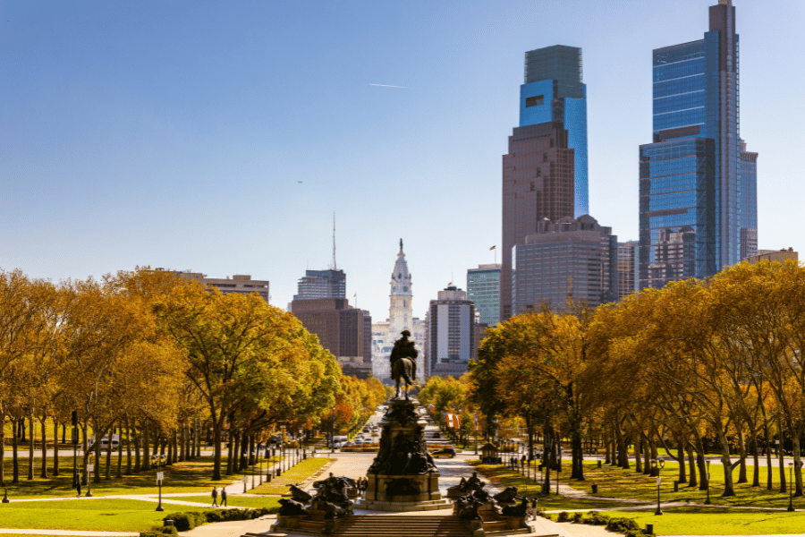 Image of downtown Philadelphia behind the statue in front of the musuem