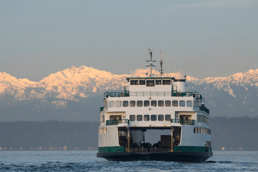 Seattle, WA ferry with water and mountains 