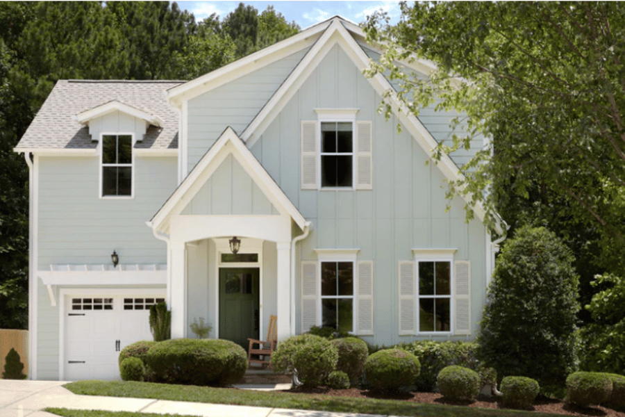 Exterior paint on a house with white shutters 
