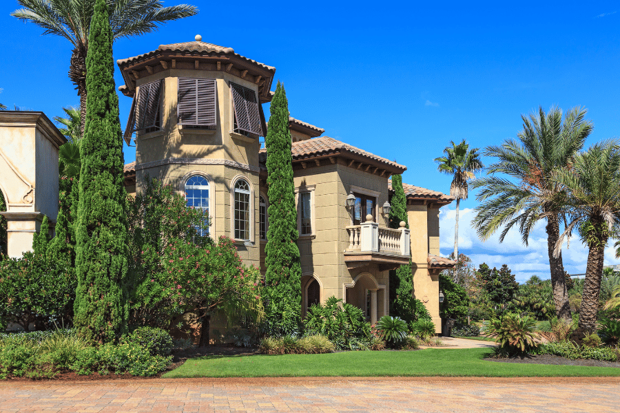 Large home in Destin, Florida, with palm trees and blue sky