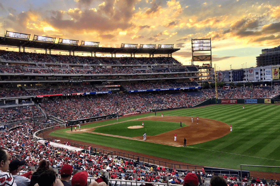 Busy Citi Field during a game with a beautiful yellow sunset