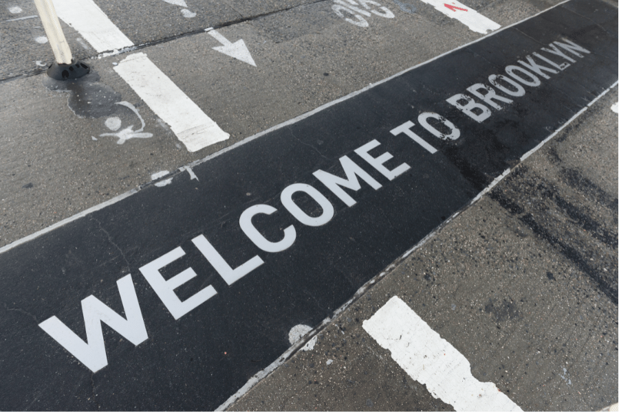 Welcome to Brooklyn written in the streets of Brooklyn NY