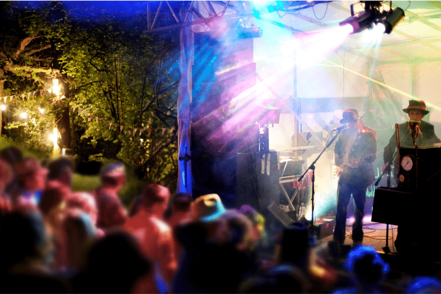 A crowd enjoying live music at night outside in Tempe, AZ