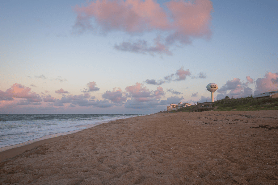 Beautiful pink sunset in Flagler Beach with water tower in the background