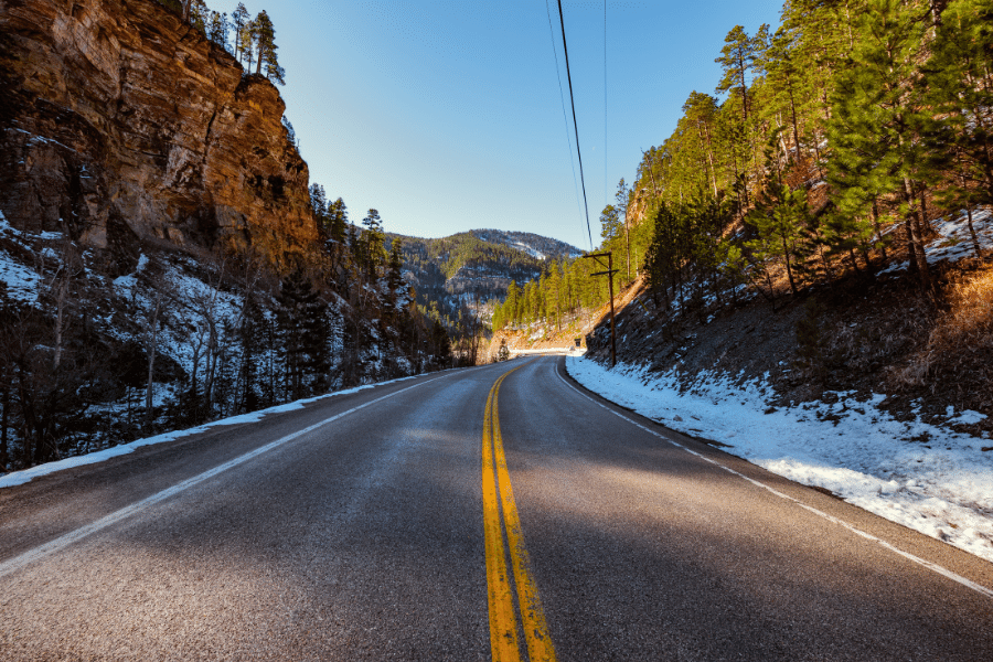 Spearfish Canyon in South Dakota with snow on the ground and trees