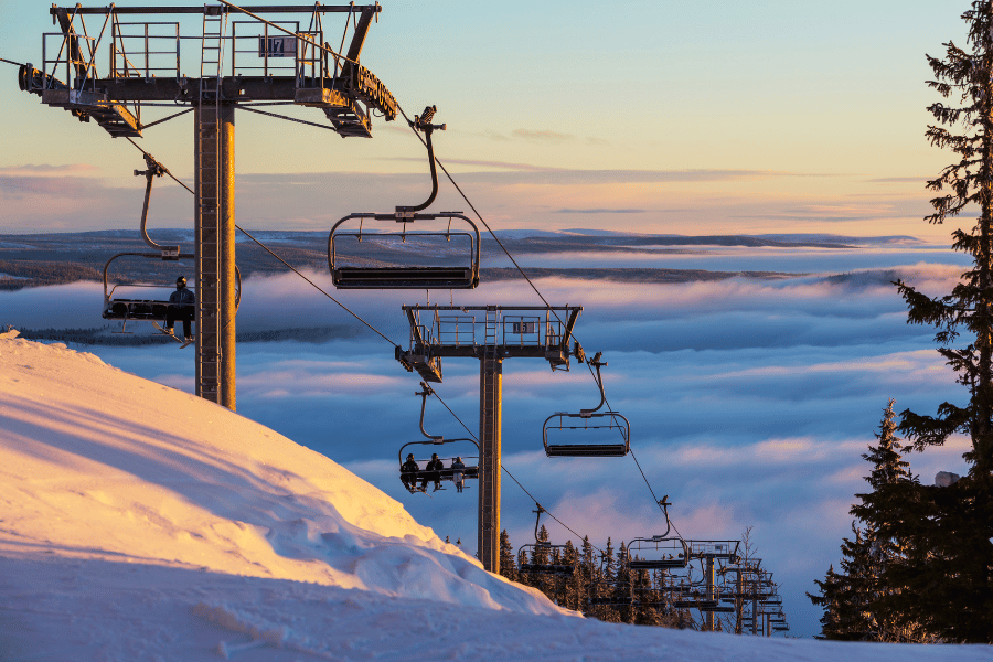beautiful ski resort with people on the ski lift 