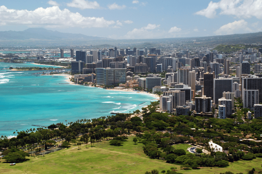 Honolulu, HI Skyline on a sunny day near the water with buildings