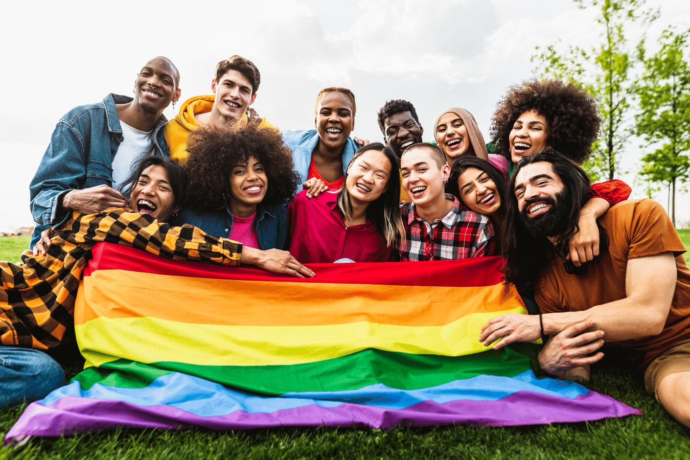 Gay Pride flag with friends enjoying a pride event