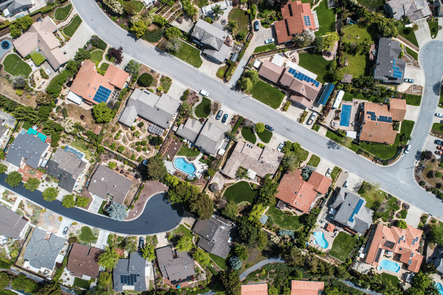 neighborhood aerial view pool homes 