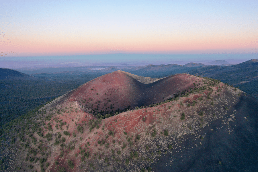 Sunset Crater in Flagstaff with purple, blue, and orange sunset