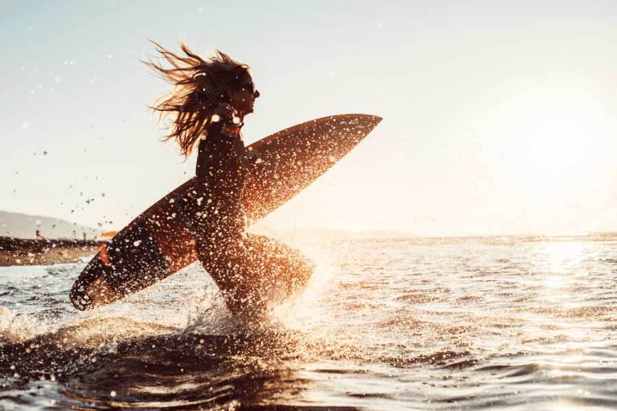 surfer girl during the sunset 