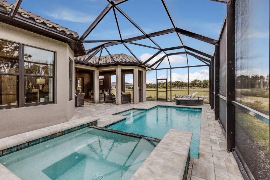 Image of Florida home with pool and glass covering in the back