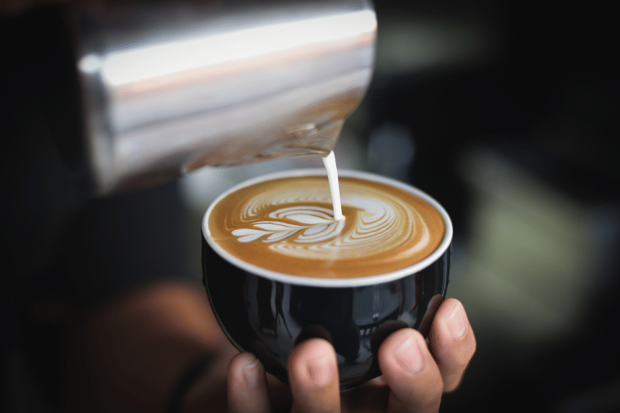 pouring latte art in mug