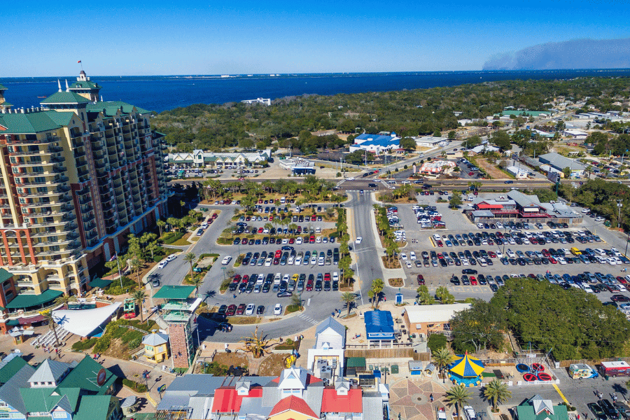 Aerial view of Destin with buildings and parking lot near the water