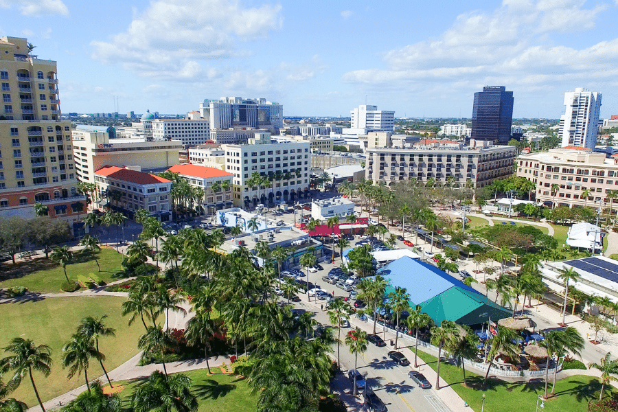 Aerial View of West Palm Beach with palm trees, buildings, and green spaces