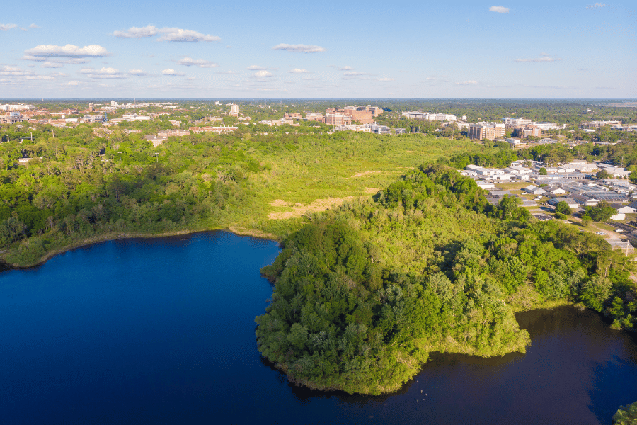 Aerial view of Gainesville, FL surrounded by the water and greenery