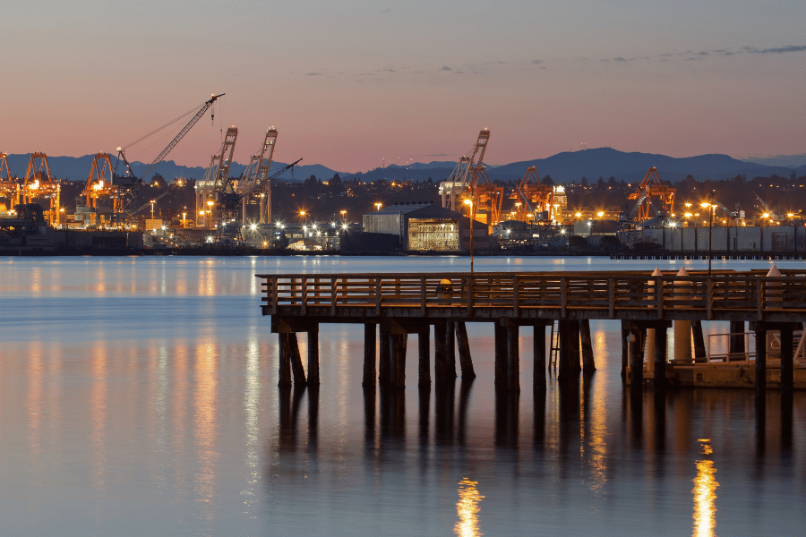 Alki Beach fishing pier at dusk with lights 