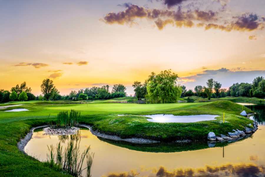 Golf course in Staten Island, NY with ponds during the sunset