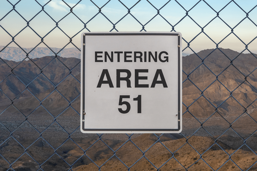 Area 51 sign in the desert on a chain link fence 