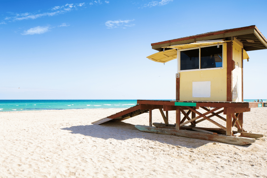 Lifeguard stand in Hollywood Beach, FL on a beautiful sunny day near the blue water
