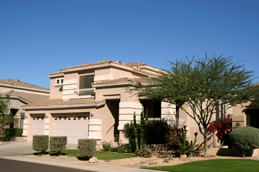 home in Phoenix, AZ with pretty landscaping and a clear blue sky