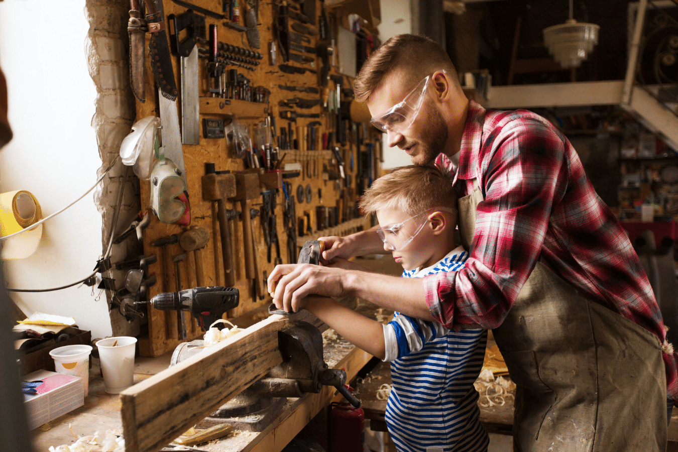 A father teaching his son the art of woodworking