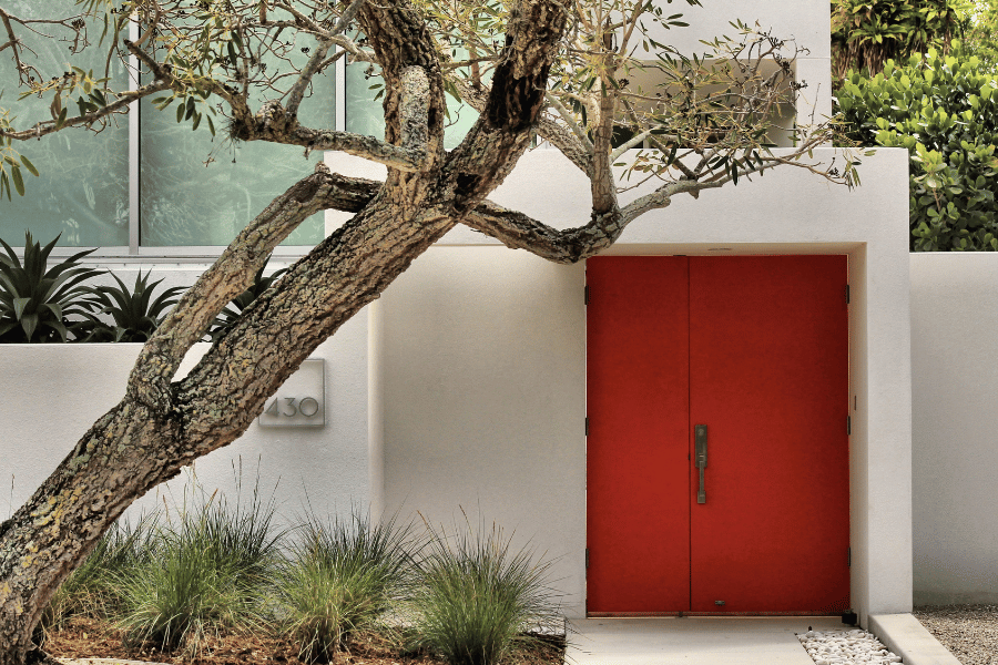 modern home sarasota florida with red door and white exterior
