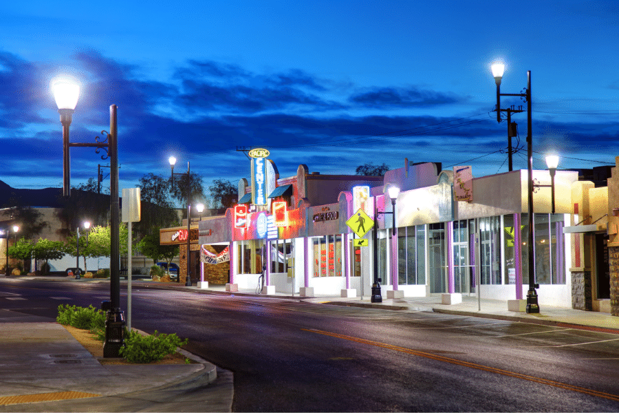 Downtown District at night in Henderson, NV with bright lights and street signs