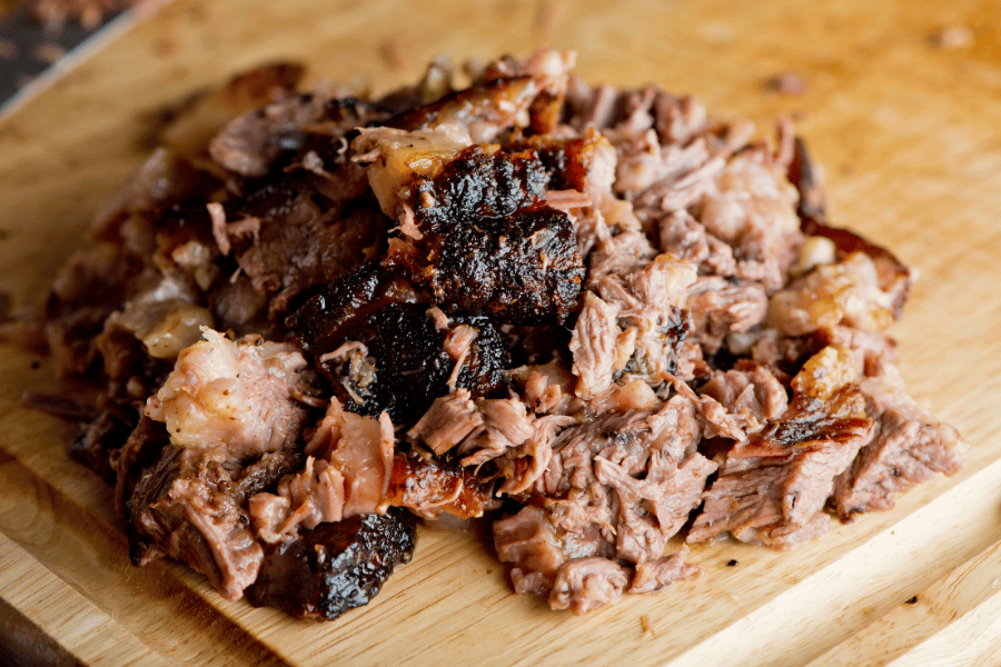 chopped brisket on a wood cutting board